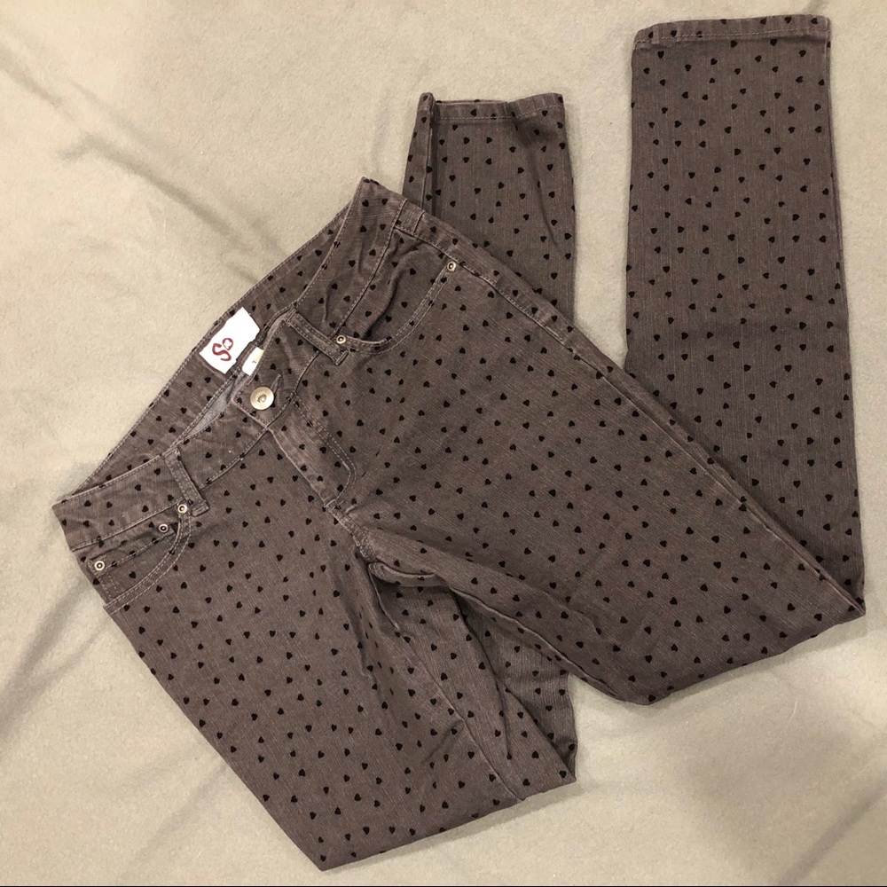 Gray skinny jeans with black hearts